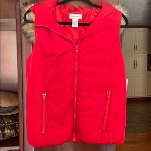 Red puffer vest with faux fur trimmed hood